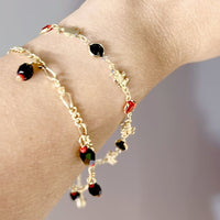 Lucky figaro charm red and black beads 18kts of gold plated bracelet bracelets